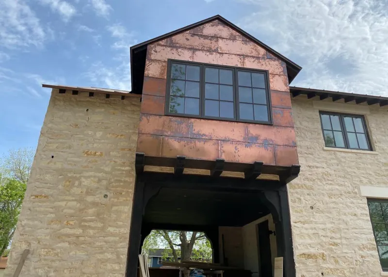 Copper metal panel facade on a stone building for Skylight Installation in Duarte