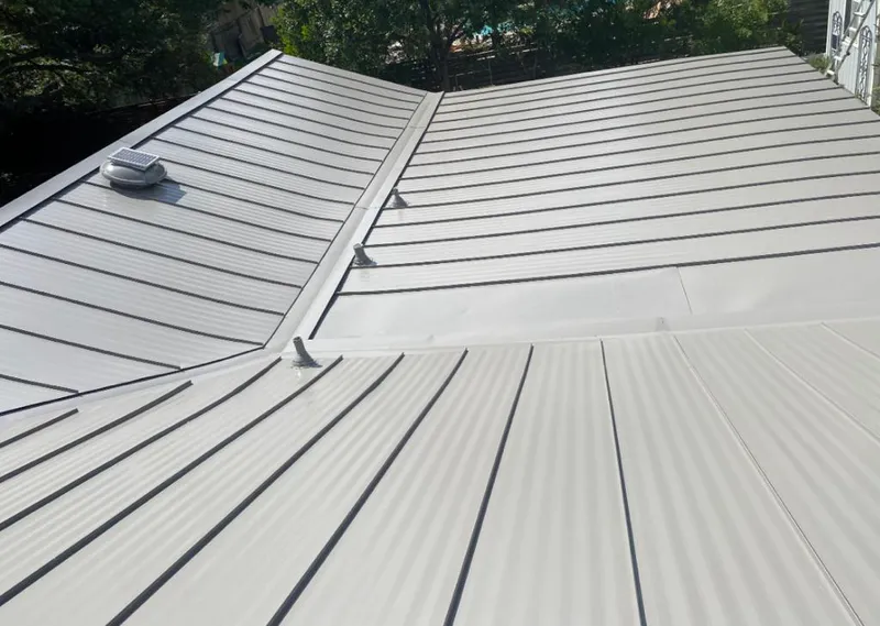 Solar attic fan installed on a metal roof for Roof Ventilation in Duarte